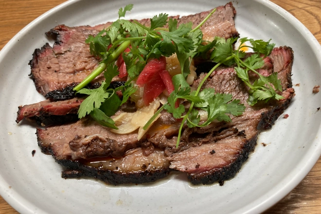 Loro Austin signature dishes Lunch Two Step, Smoked Beef Brisket, Spicy Japanese Curry Ramen, Sake Can 1/2 Chicken.